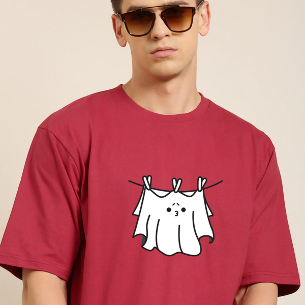 red oversized round neck tshirt with ghost design printed in front of oversized tshirt, ghost is hanging in balcony like a bedsheet